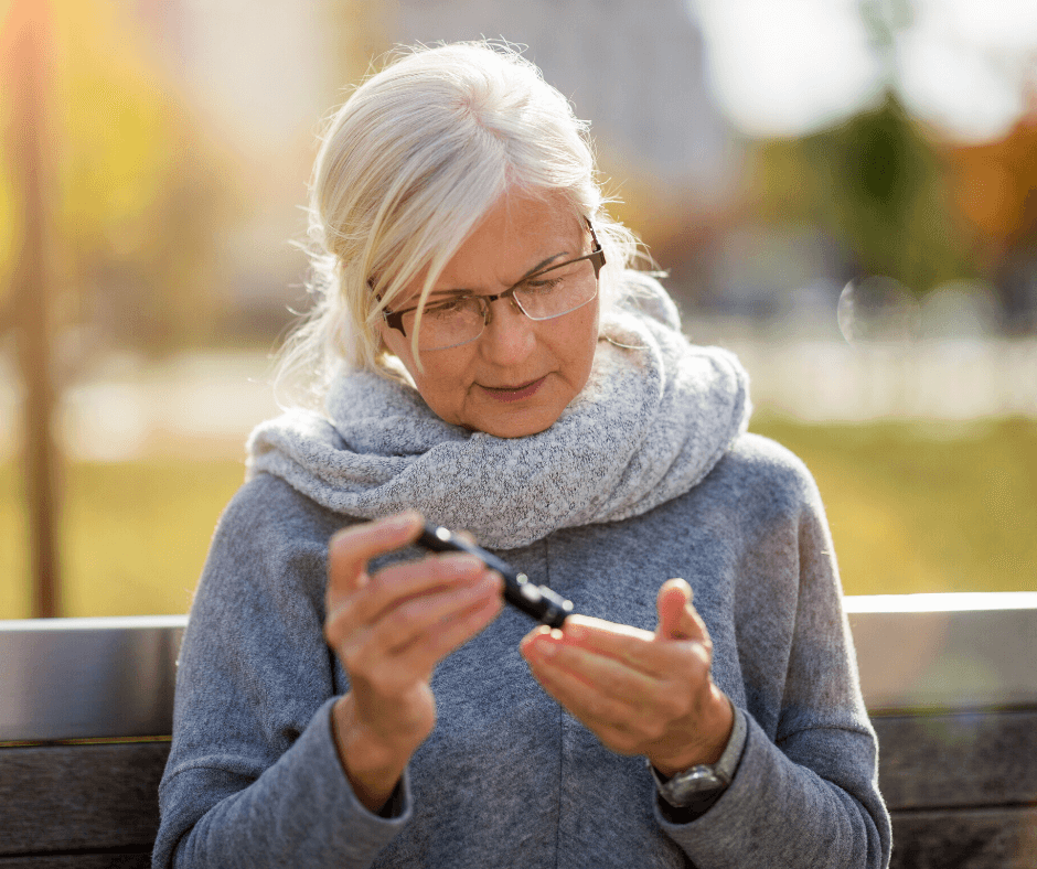 Woman taking blood sugar levels