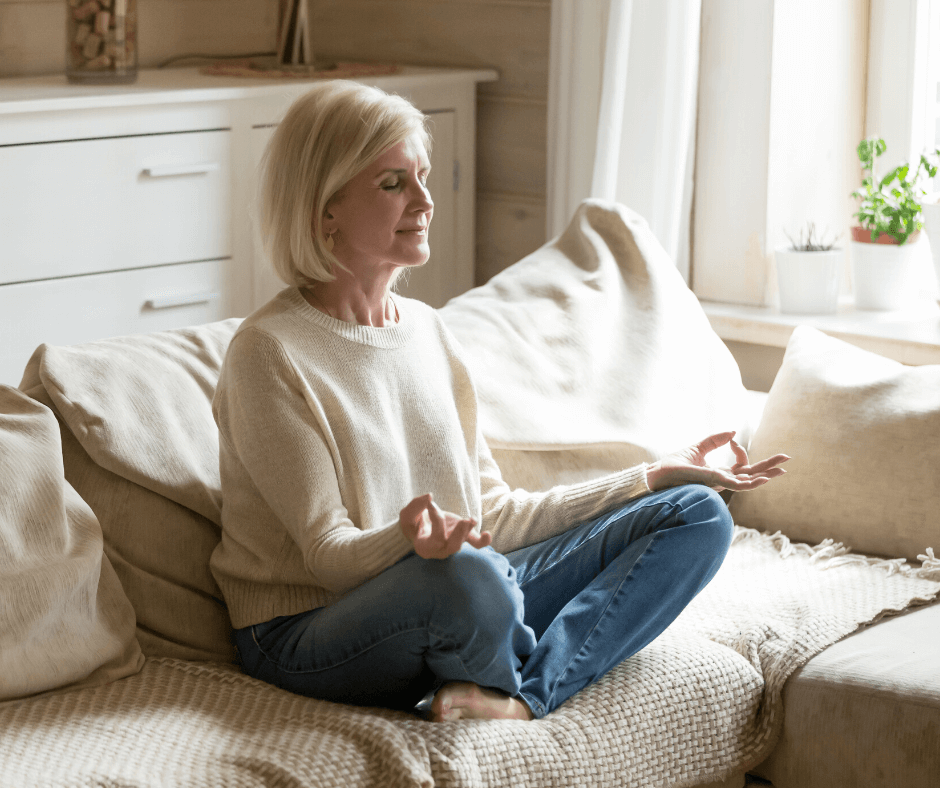 Woman meditating on the couch